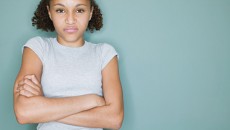 Myths about teenagers include "adopted teens are moodier," like this angry girl