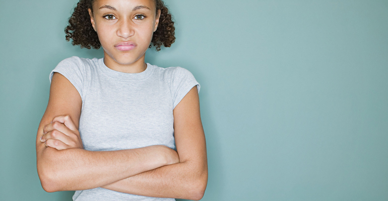 Myths about teenagers include "adopted teens are moodier," like this angry girl