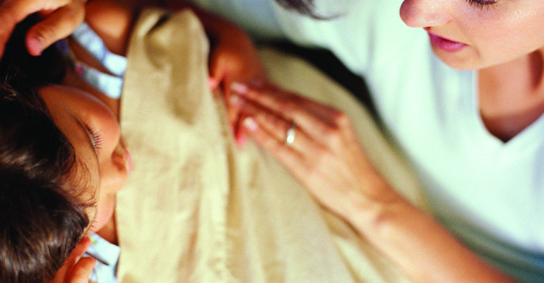 A preschooler and her mother at bedtime