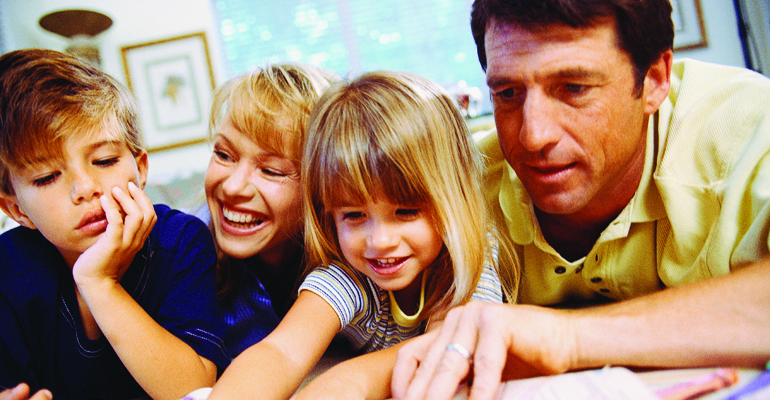 A family working together to make a lifebook