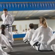 A mother trying out a tae kwon do class, while in the process of adopting a baby girl from Korea