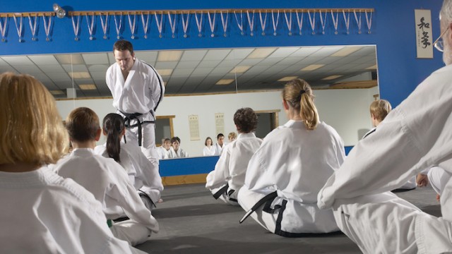 A mother trying out a tae kwon do class, while in the process of adopting a baby girl from Korea