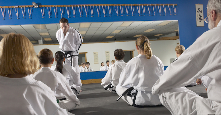 A mother trying out a tae kwon do class, while in the process of adopting a baby girl from Korea