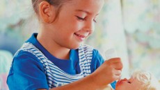 A young girl engages in pretend play