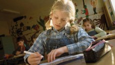 A child completes school assignments