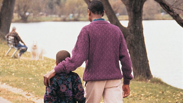 Parent and child discussing his adoption story