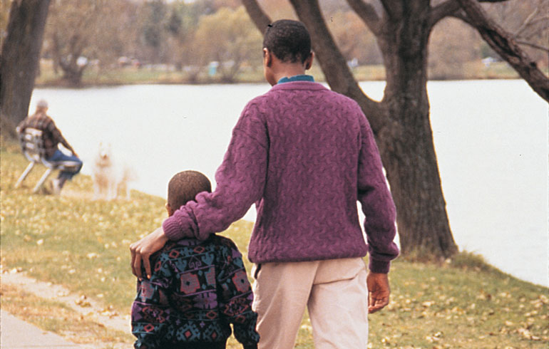 Parent and child discussing his adoption story