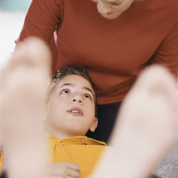 Mother reaching out to adopted son