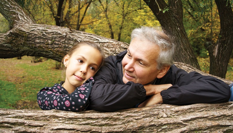 father and daughter talking about adoption outside