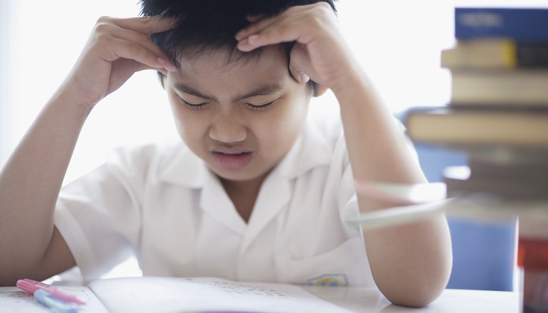 An adopted child is experiencing stress at school