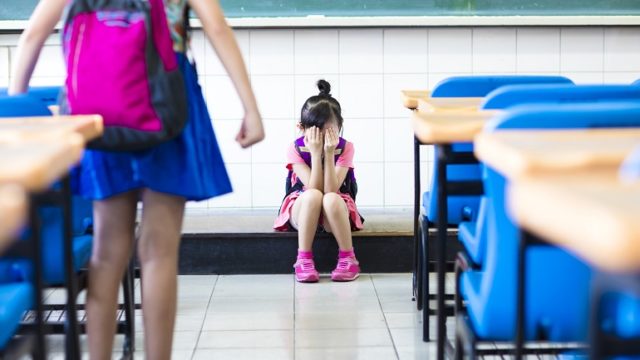 a girl who is being bullied at school