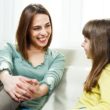 What is adoption? A mother and daughter discuss it on a couch