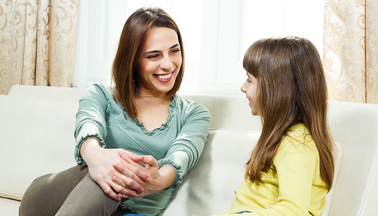 What is adoption? A mother and daughter discuss it on a couch