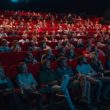 Adoption in the movies: a group of people at a theater