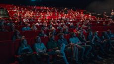 Adoption in the movies: a group of people at a theater