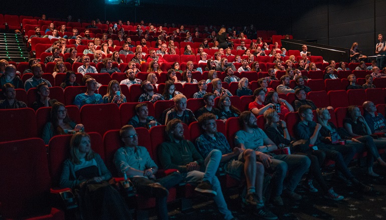 Adoption in the movies: a group of people at a theater