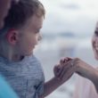 An adoptive family at the beach