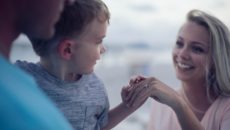 An adoptive family at the beach