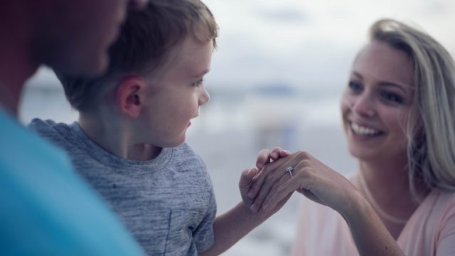 An adoptive family at the beach