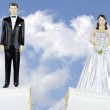 A wedding cake split in half showing adoption and divorce