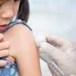 An Asian child undergoes TB tests before coming to the United States