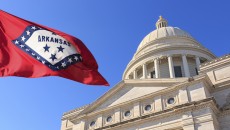 Arkansas flag, over the building where representatives decide Arkansas adoption laws