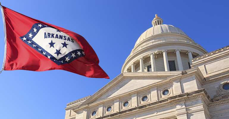 Arkansas flag, over the building where representatives decide Arkansas adoption laws