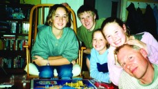 Group of siblings, several in their teen years, and father