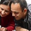 A couple investigating some of the best apps for adoptive parents