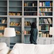 A woman looks at books about bullying