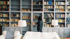 A woman looks at books about bullying