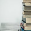 A stack of books the celebrate diversity in multiracial families