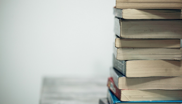 A stack of books the celebrate diversity in multiracial families