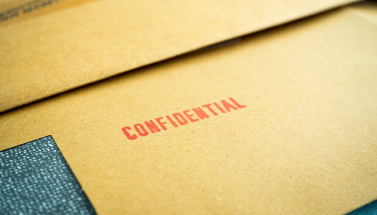 A file stamped, "Confidential" represents closed adoption records.