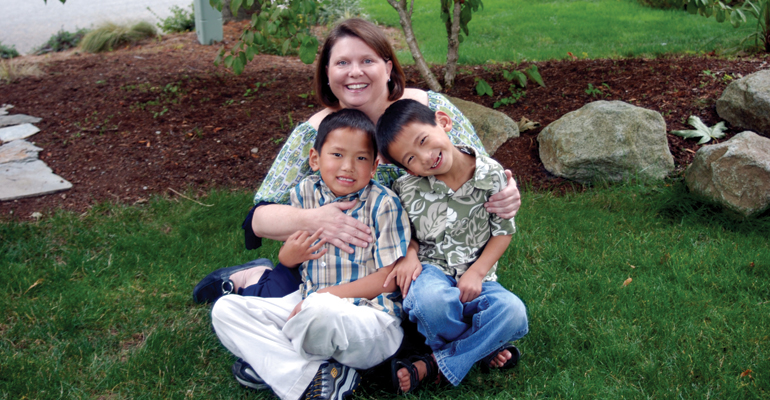 A mother and her two sons on their "adoption anniversary"