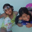 The author's daughter, Tess, swimming with a friend at her yearly India Camp
