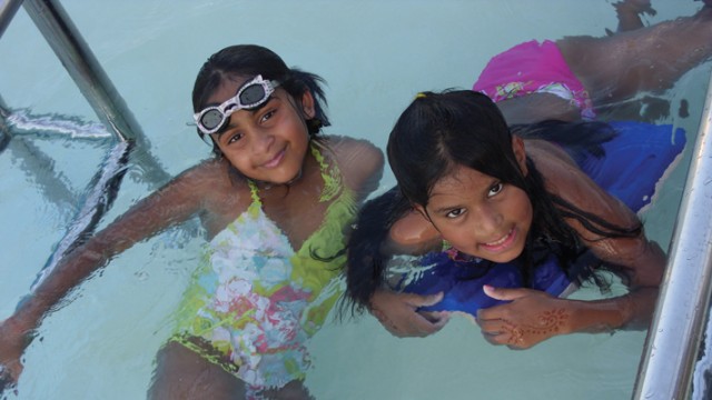 The author's daughter, Tess, swimming with a friend at her yearly India Camp