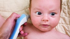 Testing a baby for vision and hearing problems