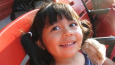 A young girl, brought to America via Honduras adoption