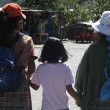 A young Guatemalan adoptee meeting her birth mother and grandmother