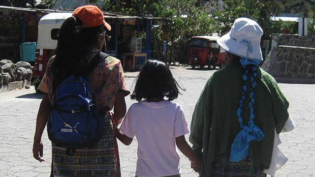 A young Guatemalan adoptee meeting her birth mother and grandmother