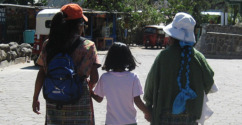 A young Guatemalan adoptee meeting her birth mother and grandmother