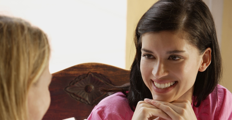 A lady thinking of questions to ask birth mothers during her first meeting with one