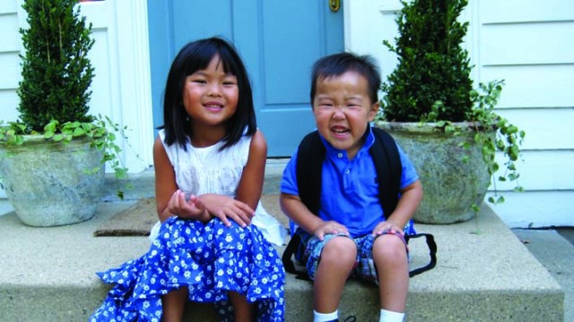 Two children before their mother's adoption presentation