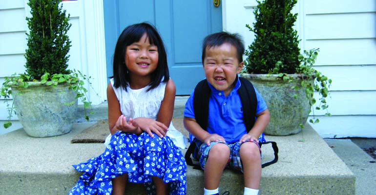 Two children before their mother's adoption presentation