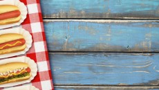 Hot dogs on a picnic table, representing the author's first summer as a mom