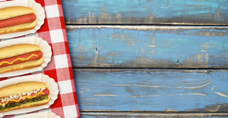 Hot dogs on a picnic table, representing the author's first summer as a mom