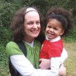 Patti Ghezzi and her daughter, a black baby with natural hair