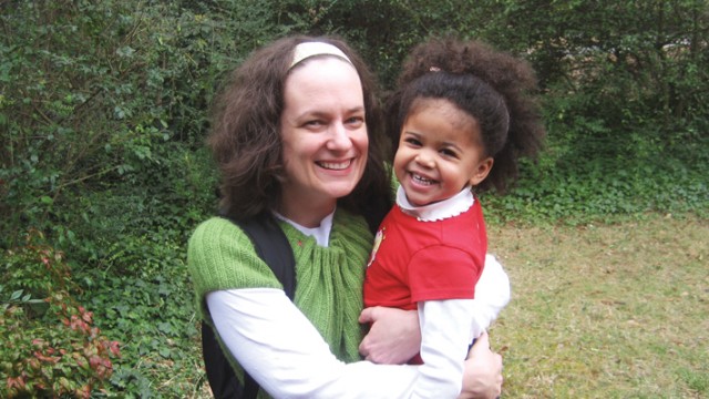 Patti Ghezzi and her daughter, a black baby with natural hair