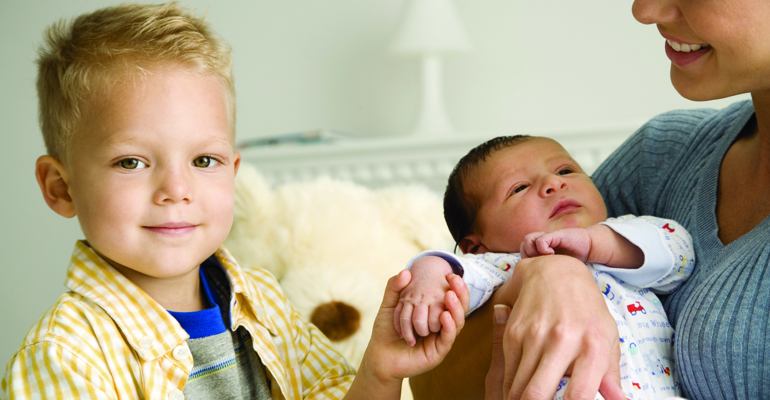 Toddler boy and his new sibling